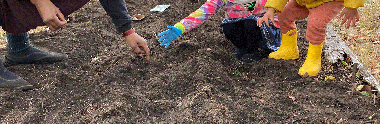 hands and boots in dirt